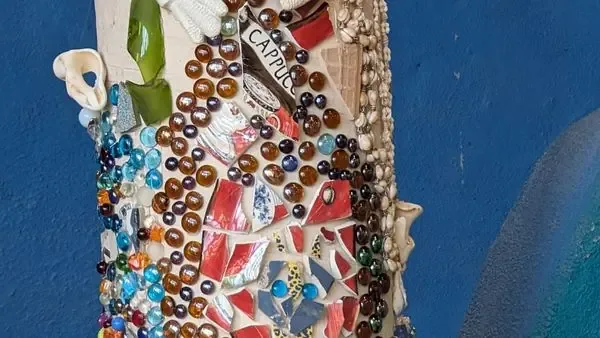 Colorful mosaic art detail at an Earthship Journey seasonal event